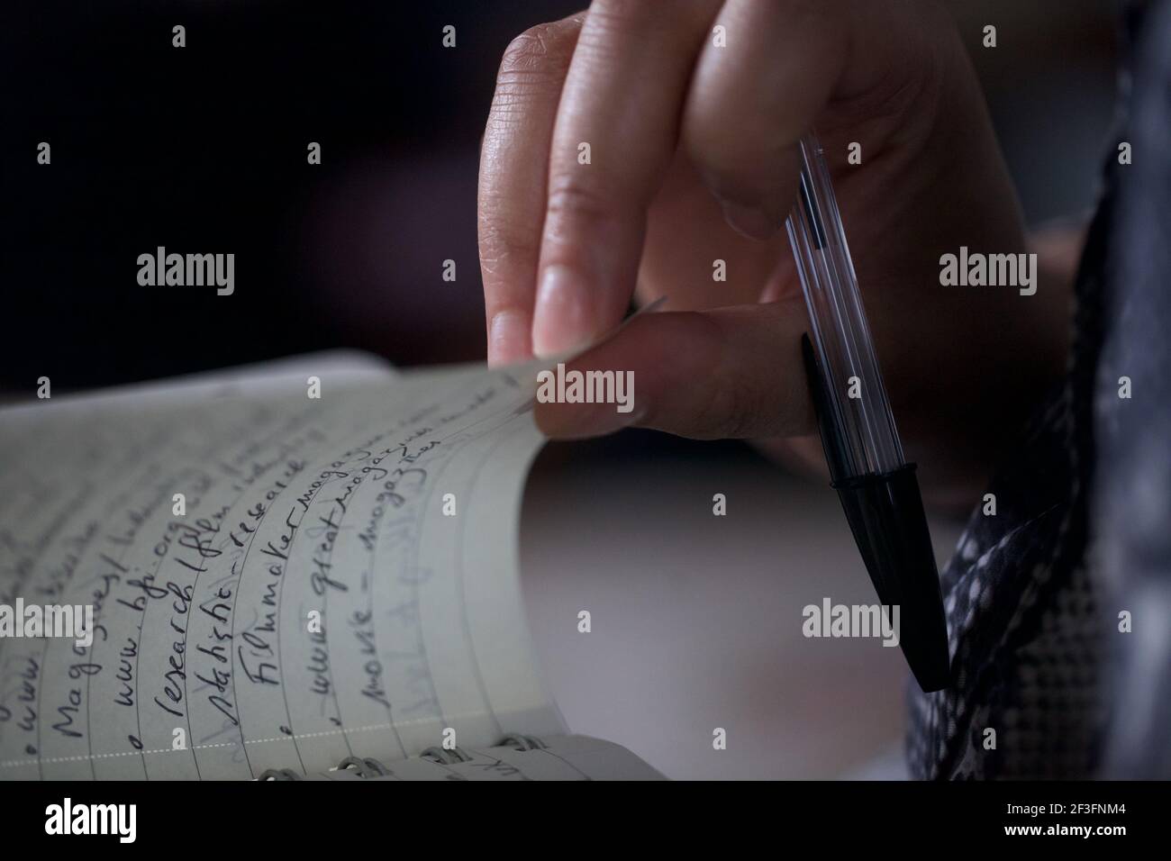 Woman`s hands writing with a pen Stock Photo